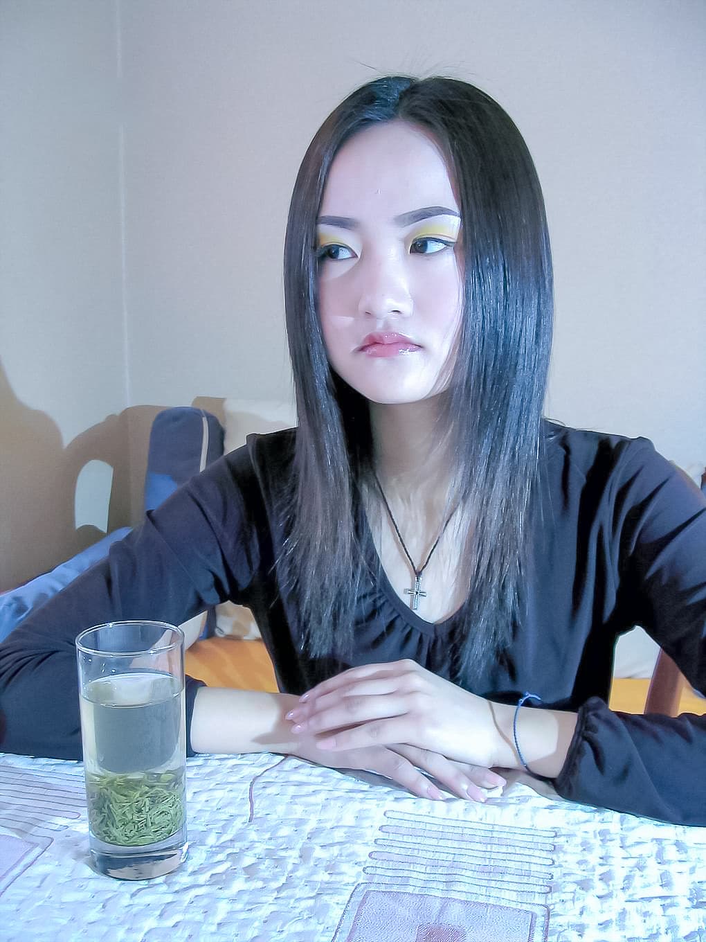 Overhead shot of delicate toes curled around sandal straps, faint stocking sheen on the arch and heel, intimate bedroom setting